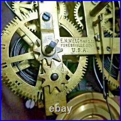 1880-85 E. N. Welch Carved Walnut Parlor Clock-8 Day Striking & Glass Pendulum
