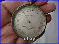 2 Antique Brass Compensated Pocket Barometers. 1 is by Negretti & Zambra