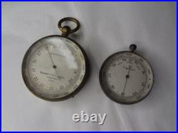 2 Antique Brass Compensated Pocket Barometers. 1 is by Negretti & Zambra