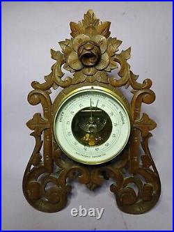 An Antique Blackforest style hand carved German Barometer