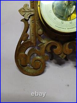 An Antique Blackforest style hand carved German Barometer