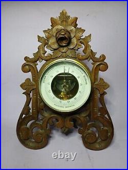 An Antique Blackforest style hand carved German Barometer