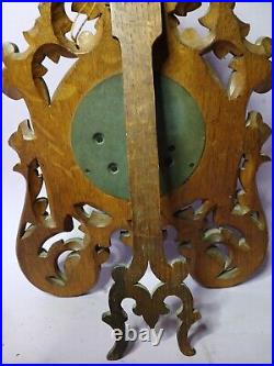 An Antique Blackforest style hand carved German Barometer