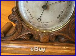 Antique Barometer on an oak stand by Negretti & Zambra, London England