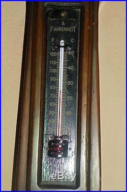 Barometer with Clock and Thermometer. Dark Walnut-Colored Wood. C. 1920-1930