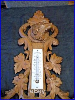 Beautiful old barometer in black forest wood