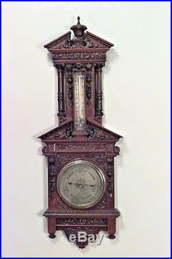 English Victorian walnut carved wall barometer and thermometer