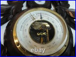 The beautiful, richly carved Black Forest barometer