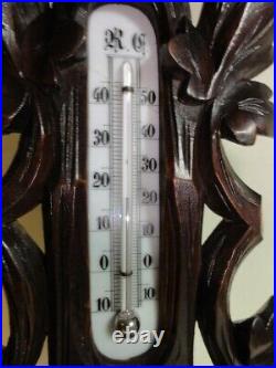 The beautiful, richly carved Black Forest barometer